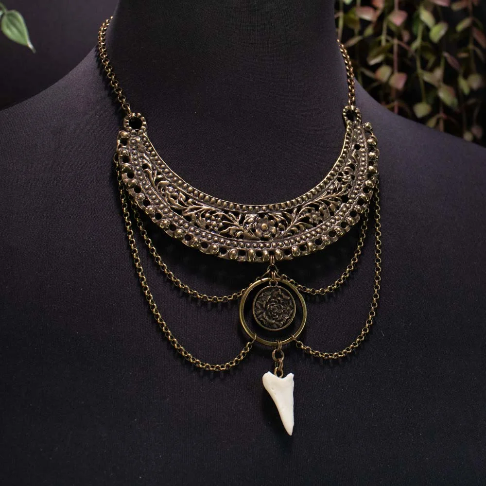 Tribal style bone jewelry with a rigid metal collar and ethically sourced deer bone.