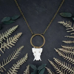 Handcrafted marten atlas bone necklace featuring a natural vertebra in a bronze setting.