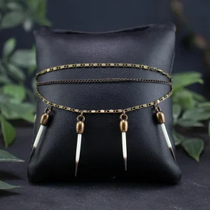 Side view of the textured bronze band and the protective finish on the quill tips