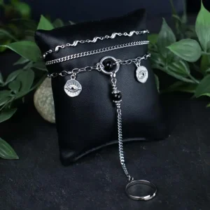 Focus on the durable stainless steel link pattern and the deep black onyx texture of the hand jewelry.