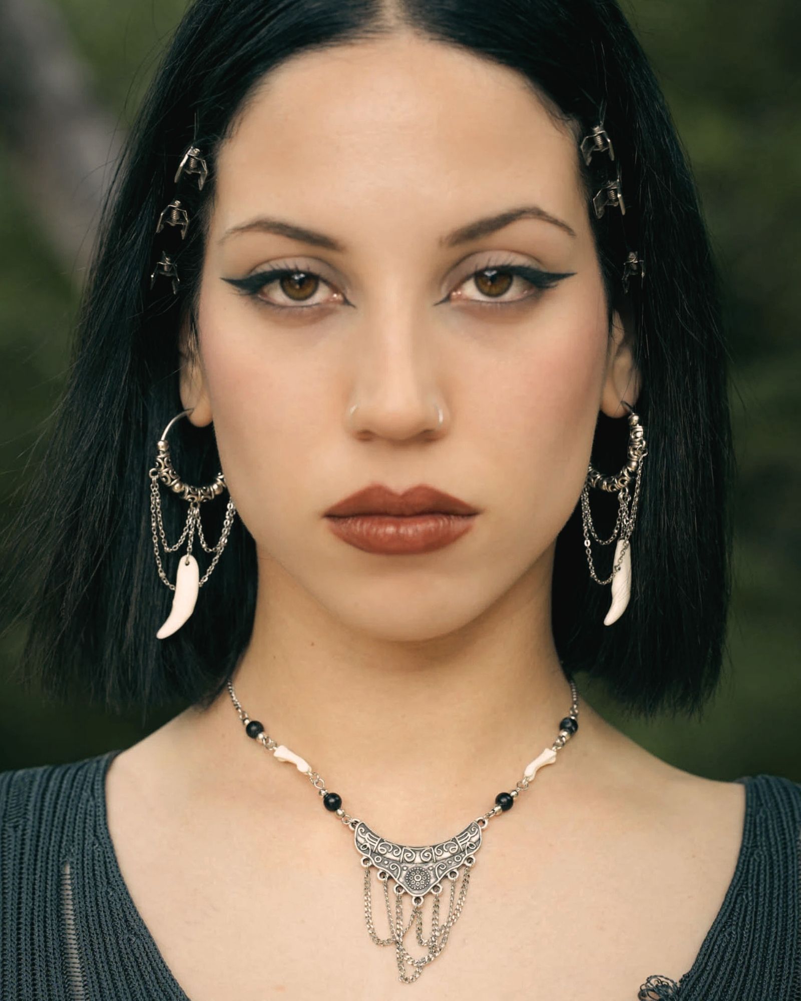 Gothic girl with silver fang hoops