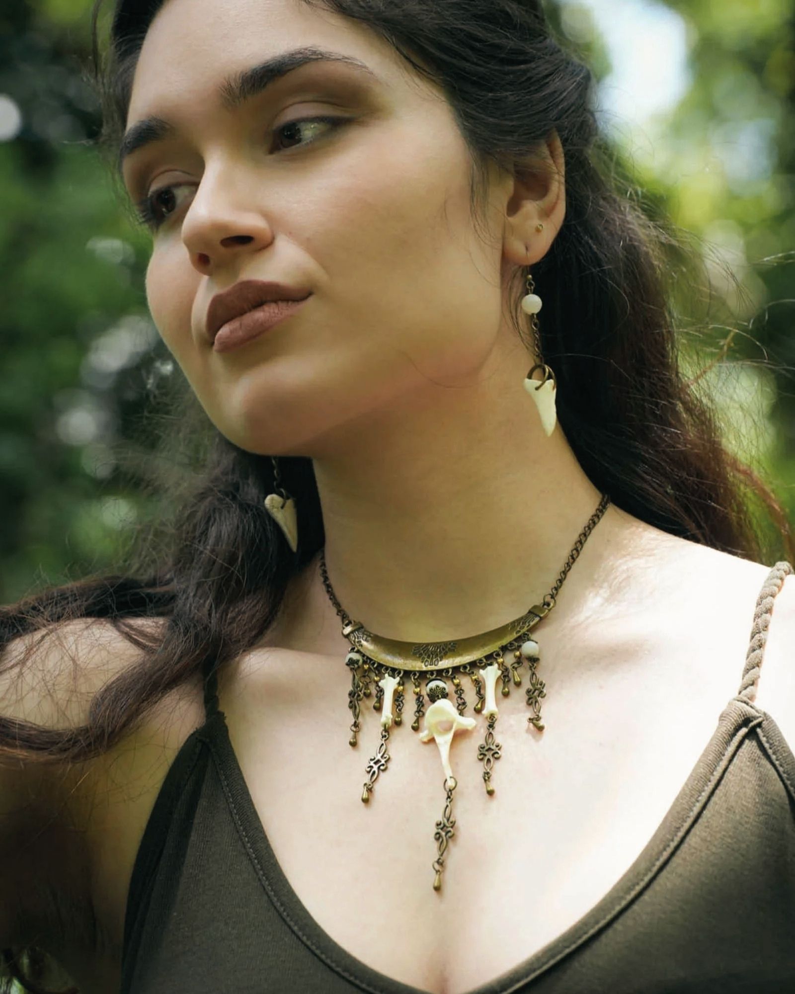 Girl wearing ethnic bone necklace.